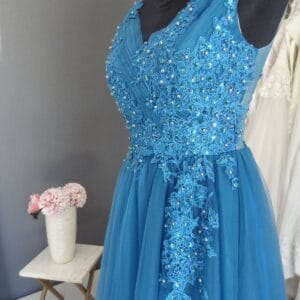 #7837 Teal Coloured Beaded Evening Gown with tulle Skirt, Love Knots Designs