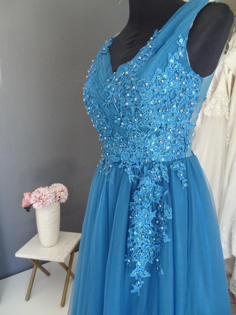 #7837 Teal Coloured Beaded Evening Gown with tulle Skirt, Love Knots Designs